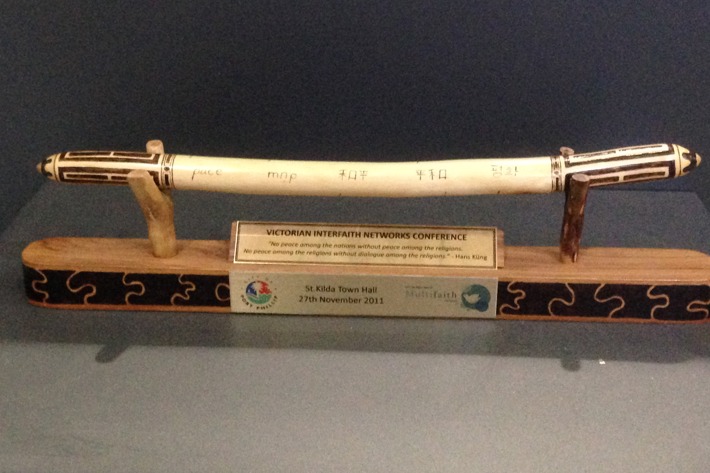 Message stick inscribed with the word peace in different languages